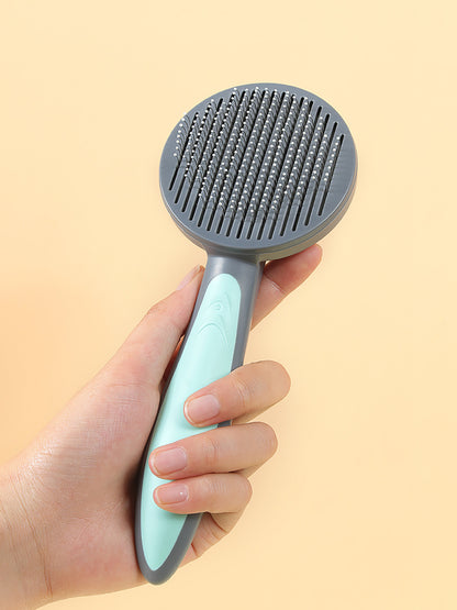 Brosse peigne pour chat Kimpets - Conçue de manière confortable et ergonomique pour nettoyer les poils morts de votre chat